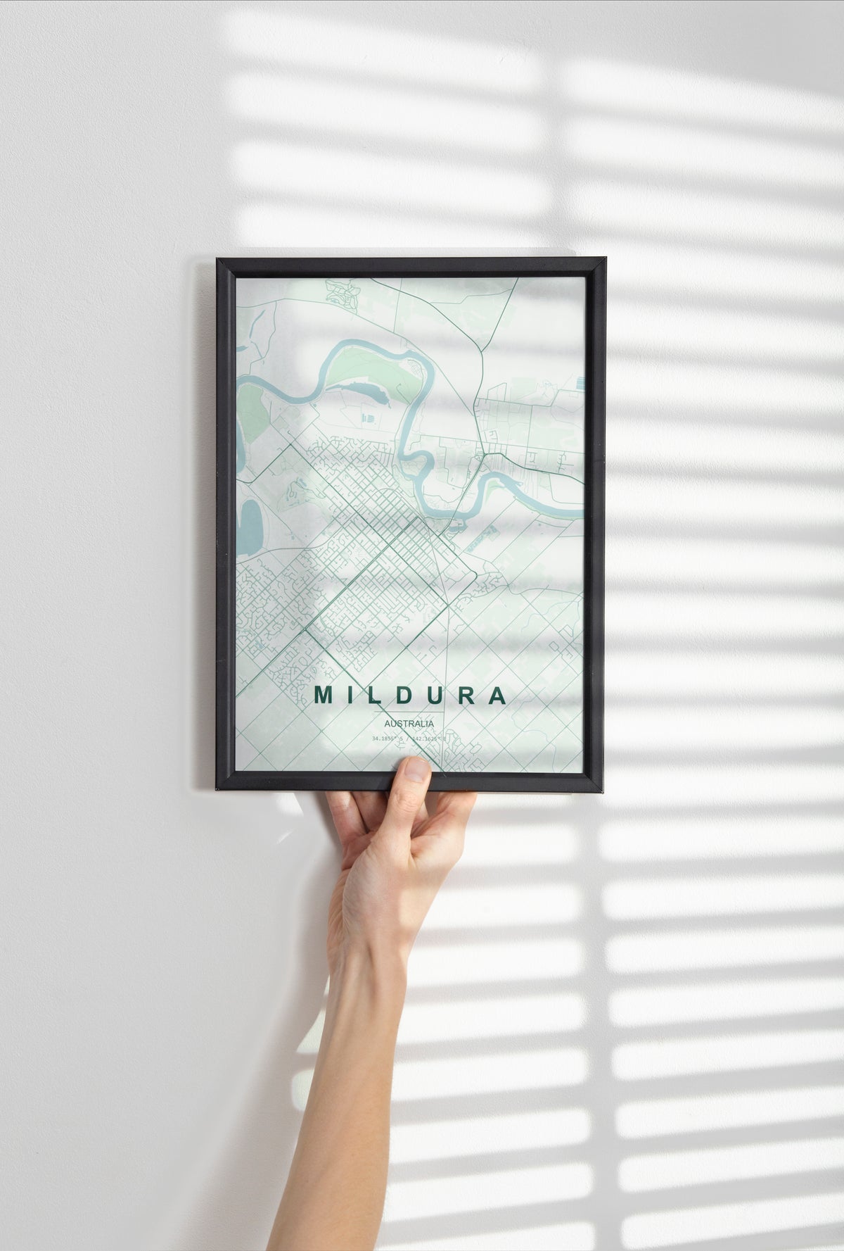 Mildura, Victoria, Australia map print in the Forest theme in a black frame held against a pale wall