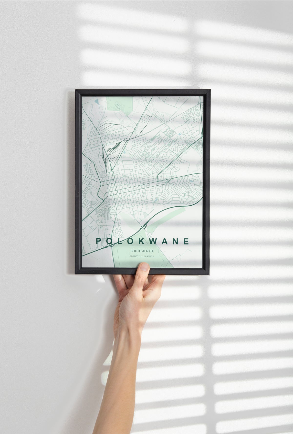 Polokwane, Limpopo, South Africa map print in the Forest theme in a black frame held against a pale wall
