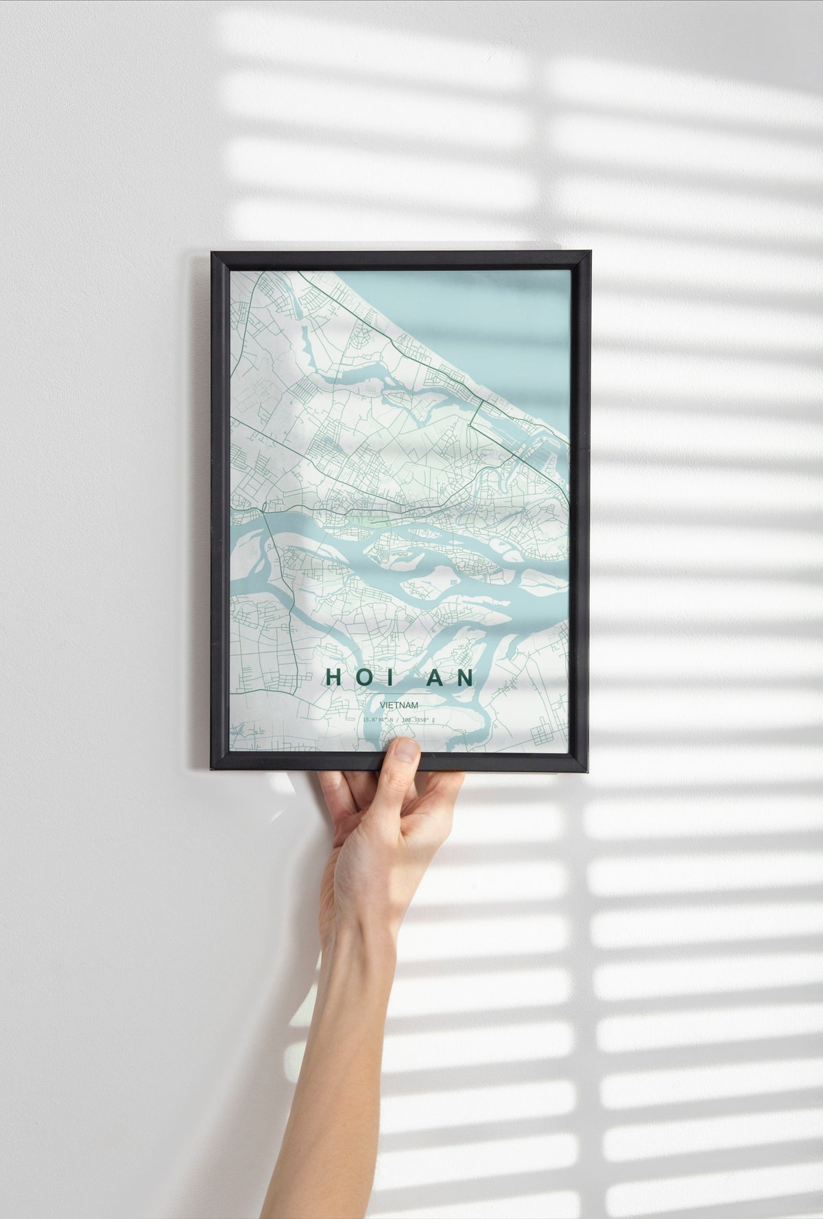 Hoi An, Vietnam map print in the Forest theme in a black frame held against a pale wall