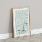 Mendoza, Argentina map print in the Forest theme in a light wooden frame leaning against a pale wall