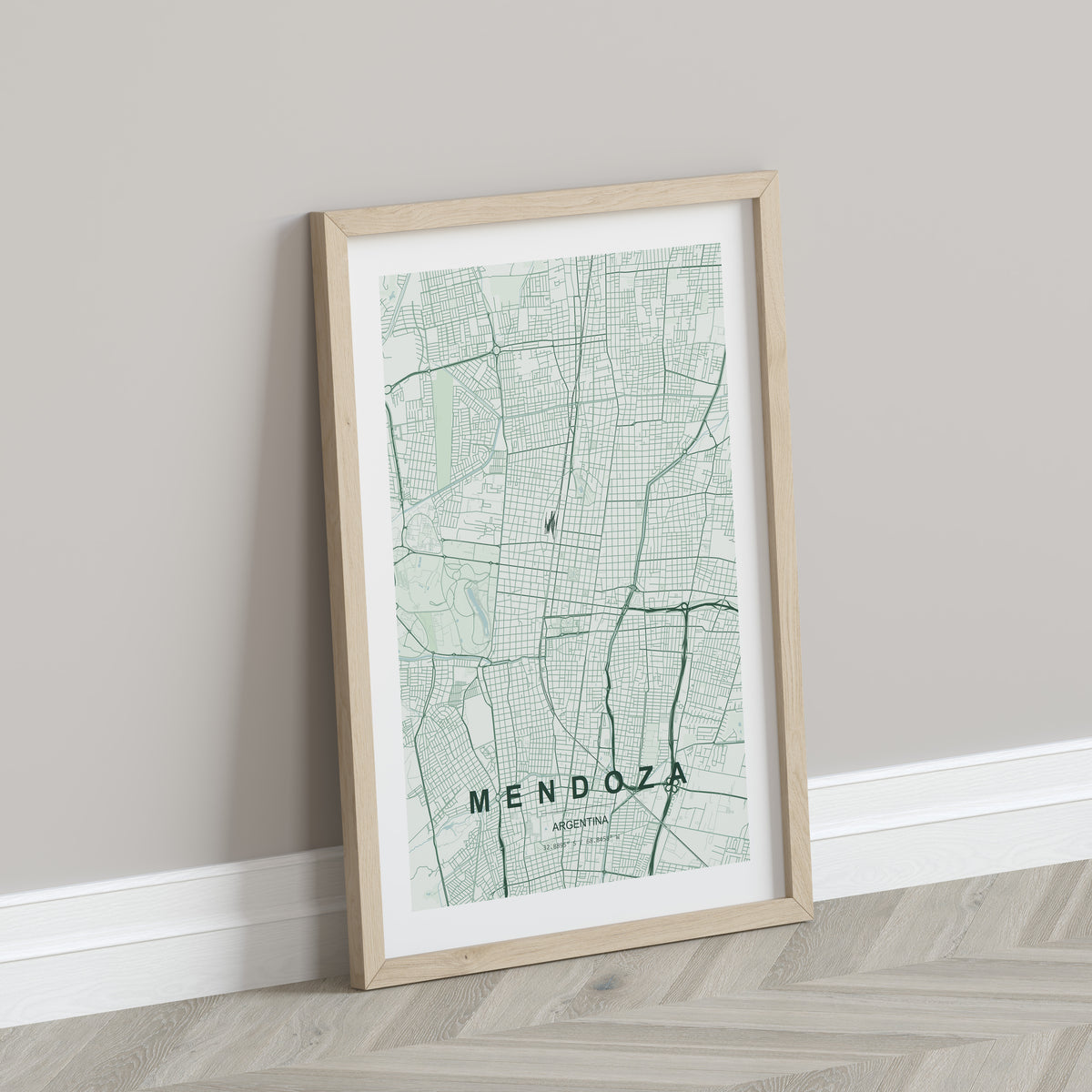 Mendoza, Argentina map print in the Forest theme in a light wooden frame leaning against a pale wall