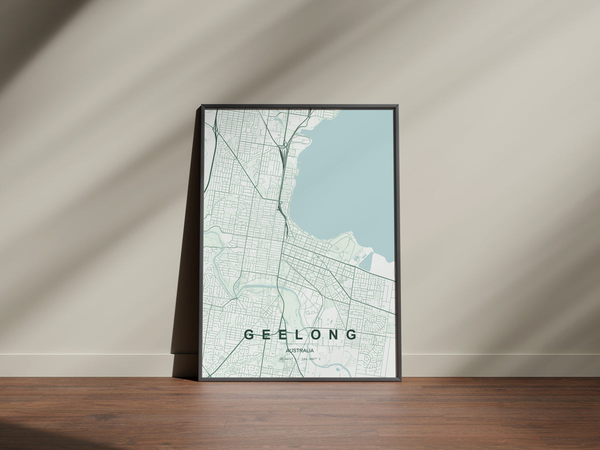 Geelong, Victoria, Australia map print in the Forest theme in a black frame on a wooden surface against a pale wall