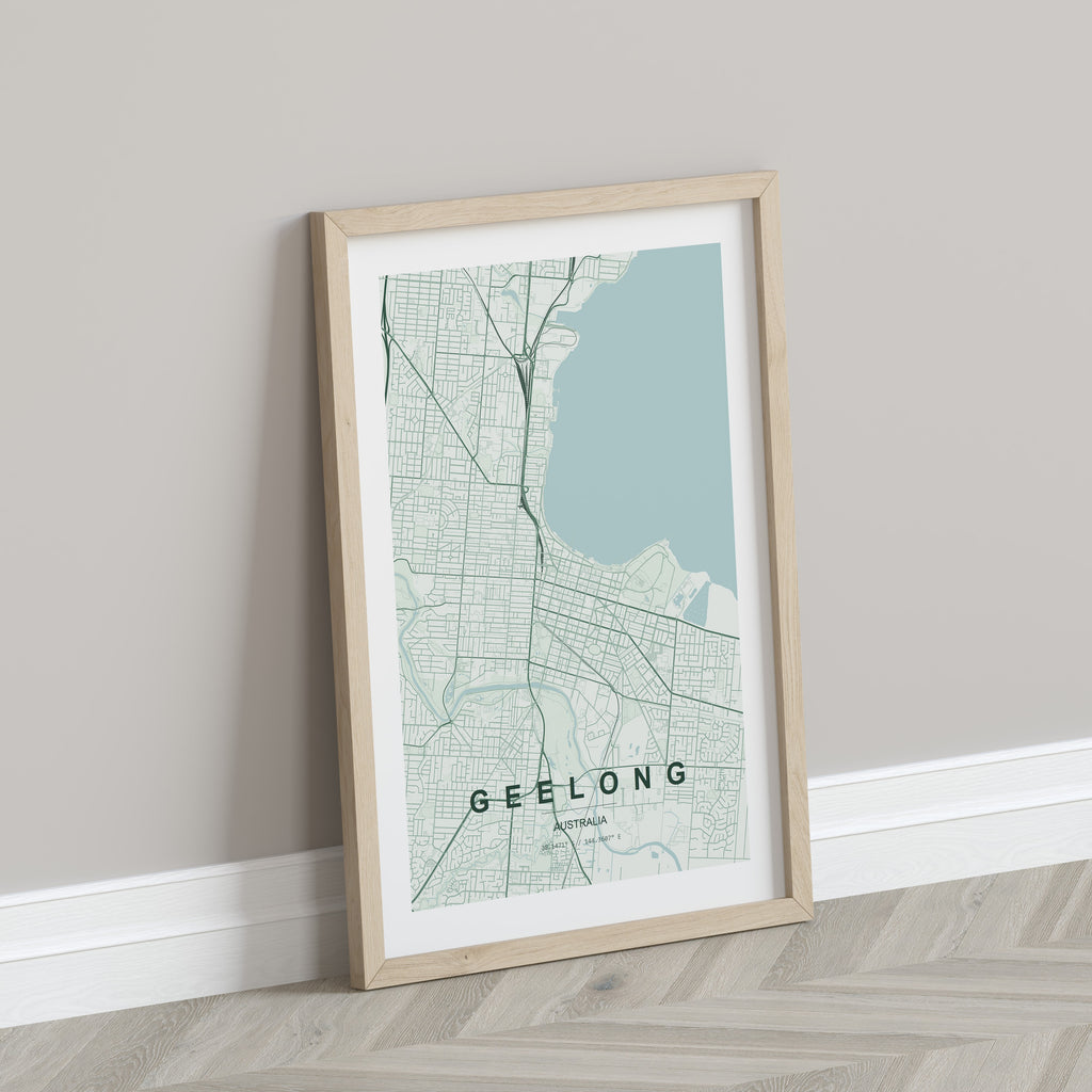 Geelong, Victoria, Australia map print in the Forest theme in a light wooden frame leaning against a pale wall