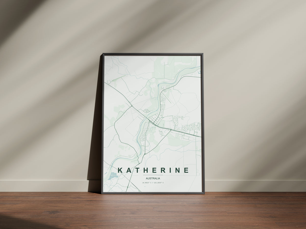 Katherine, Northern Territory, Australia map print in the Forest theme in a black frame on a wooden surface against a pale wall