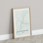 Katherine, Northern Territory, Australia map print in the Forest theme in a light wooden frame leaning against a pale wall