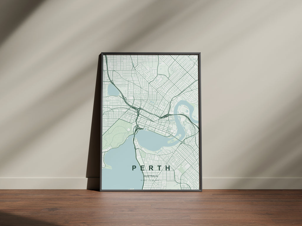 Perth, Western Australia, Australia map print in the Forest theme in a black frame on a wooden surface against a pale wall
