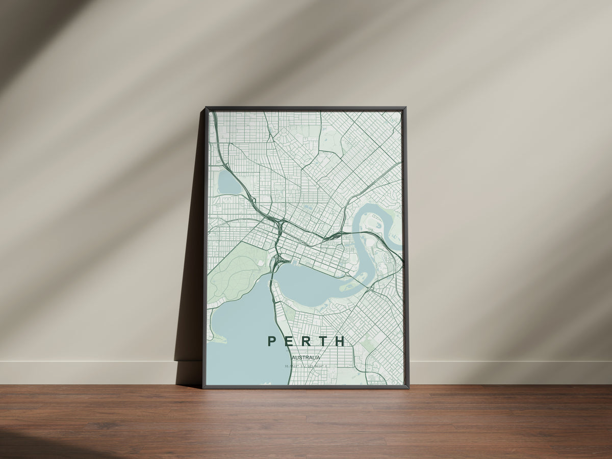 Perth, Western Australia, Australia map print in the Forest theme in a black frame on a wooden surface against a pale wall