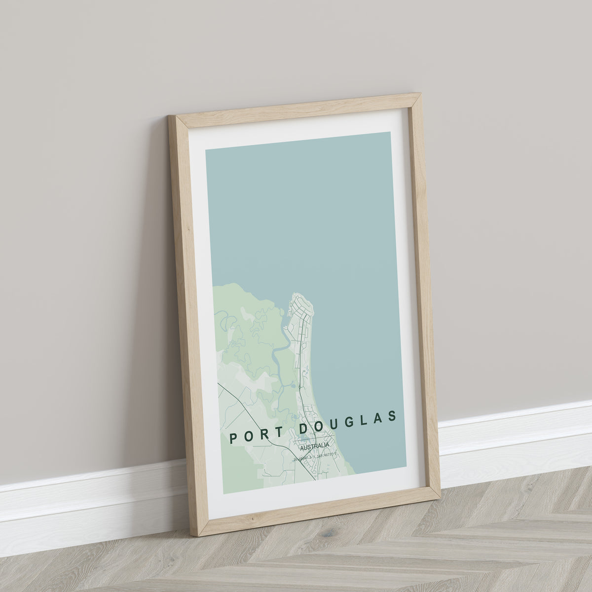 Port Douglas, Queensland, Australia map print in the Forest theme in a light wooden frame leaning against a pale wall