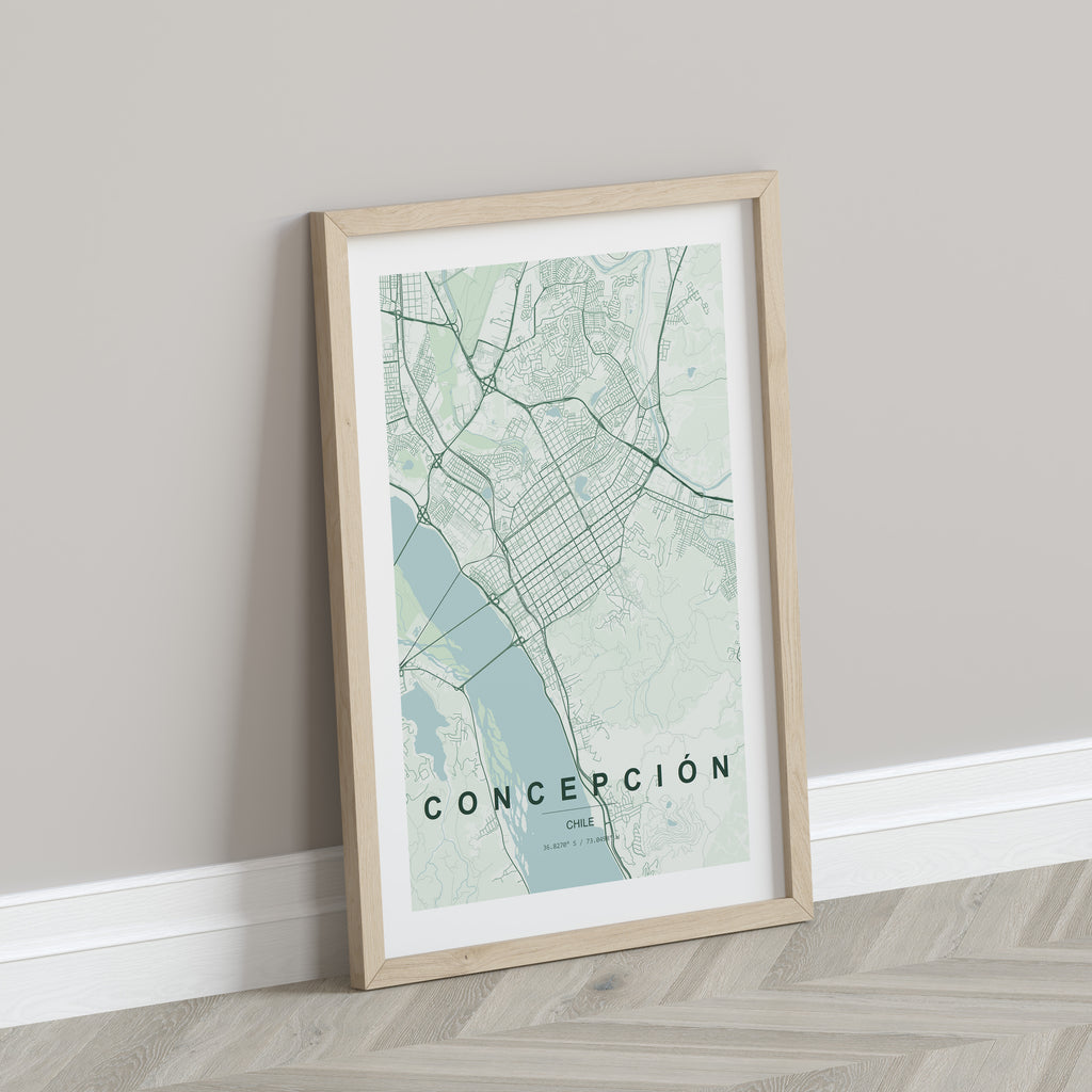 Concepción, Chile map print in the Forest theme in a light wooden frame leaning against a pale wall