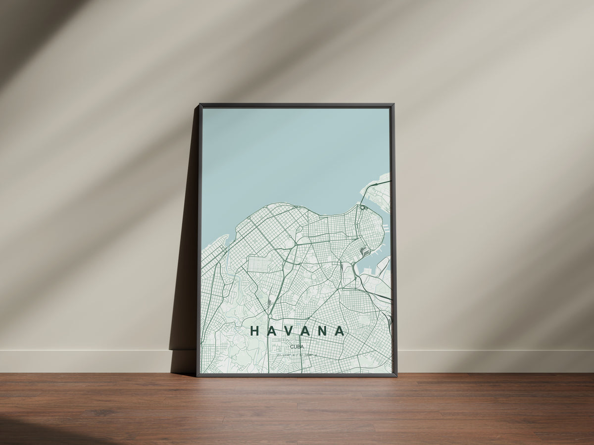 Havana, Cuba map print in the Forest theme in a black frame on a wooden surface against a pale wall
