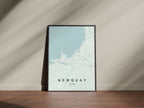 Newquay, England, United Kingdom map print in the Forest theme in a black frame on a wooden surface against a pale wall