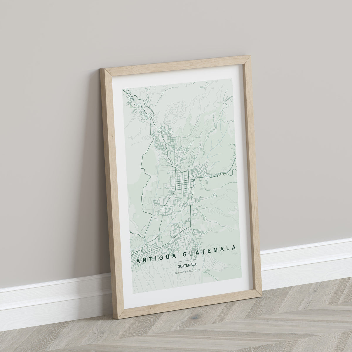 Antigua Guatemala, Guatemala map print in the Forest theme in a light wooden frame leaning against a pale wall