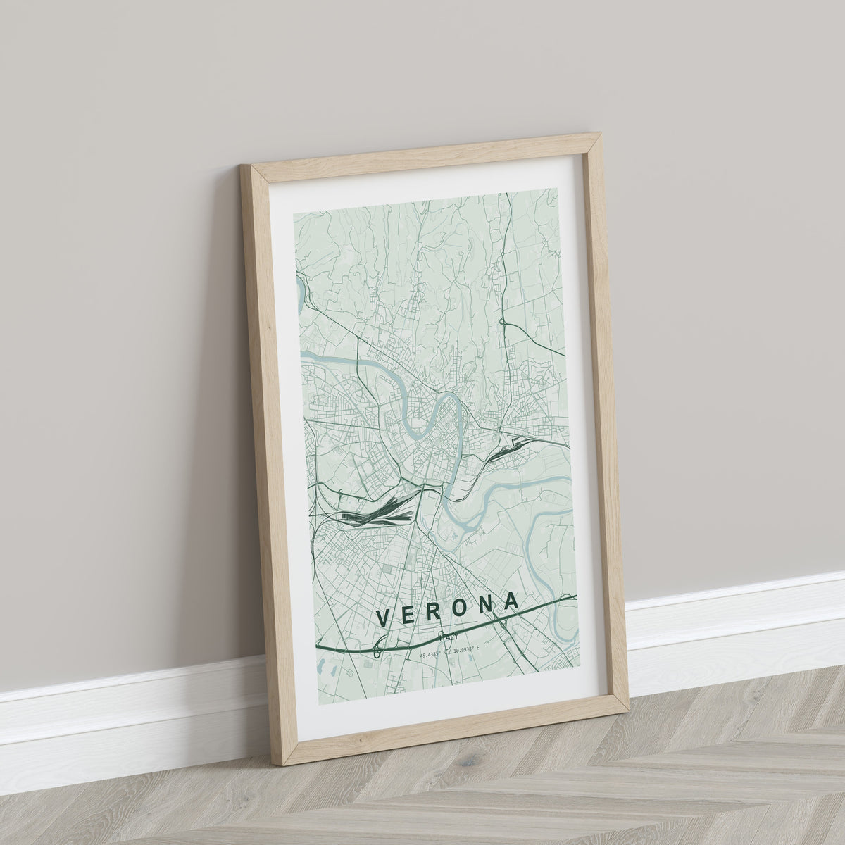Verona map print in the Forest theme in a light wooden frame leaning against a pale wall