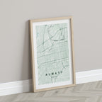 Almaty, Kazakhstan map print in the Forest theme in a light wooden frame leaning against a pale wall
