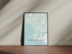 Mazatlán, Mexico map print in the Forest theme in a black frame on a wooden surface against a pale wall