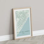 Playa del Carmen, Mexico map print in the Forest theme in a light wooden frame leaning against a pale wall