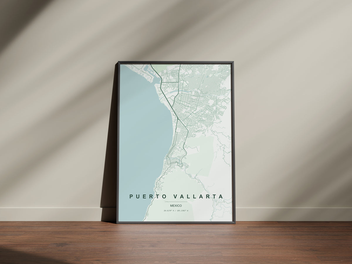 Puerto Vallarta, Mexico map print in the Forest theme in a black frame on a wooden surface against a pale wall