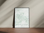 San Miguel de Allende, Mexico map print in the Forest theme in a black frame on a wooden surface against a pale wall