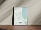 Granada, Nicaragua map print in the Forest theme in a black frame on a wooden surface against a pale wall
