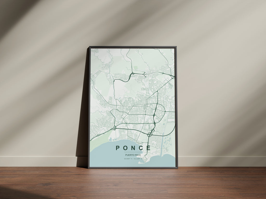 Ponce, Puerto Rico, United States map print in the Forest theme in a black frame on a wooden surface against a pale wall
