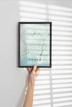 Ponce, Puerto Rico, United States map print in the Forest theme in a black frame held against a pale wall