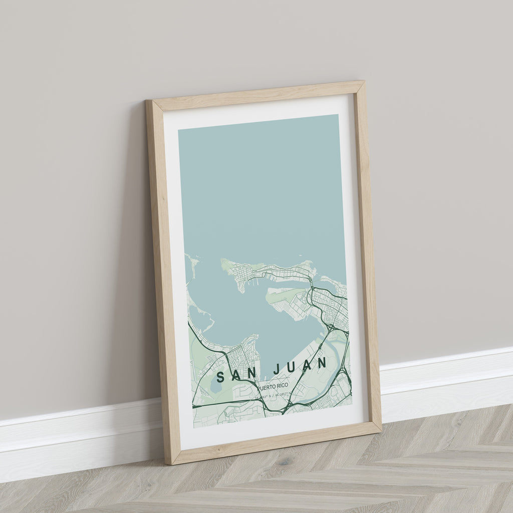 San Juan, Puerto Rico, United States map print in the Forest theme in a light wooden frame leaning against a pale wall