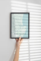 Aberdeen, Scotland, United Kingdom map print in the Forest theme in a black frame held against a pale wall