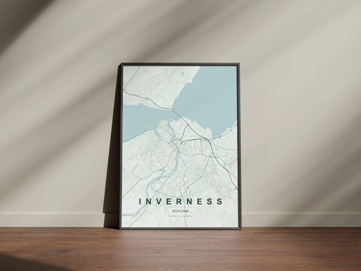Inverness, Scotland, United Kingdom map print in the Forest theme in a black frame on a wooden surface against a pale wall
