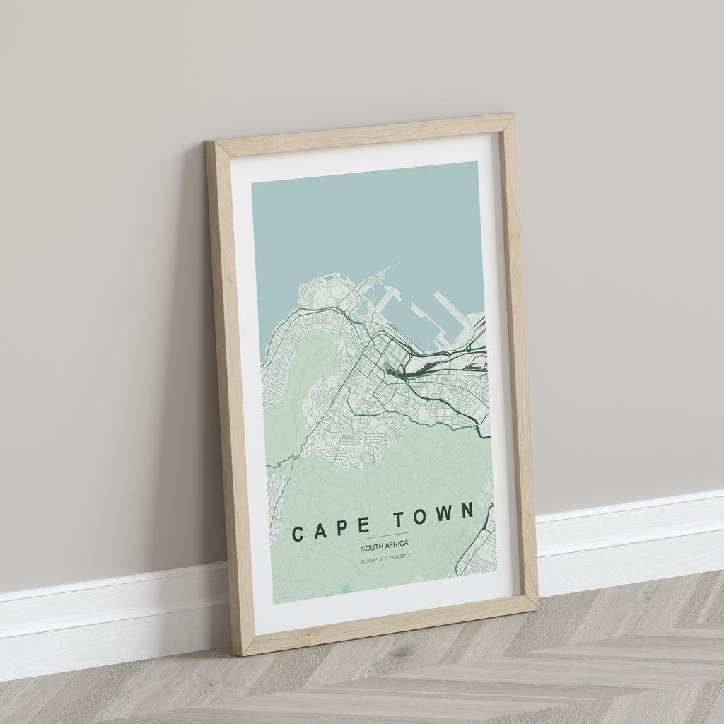 Cape Town, Western Cape, South Africa map print in the Forest theme in a light wooden frame leaning against a pale wall