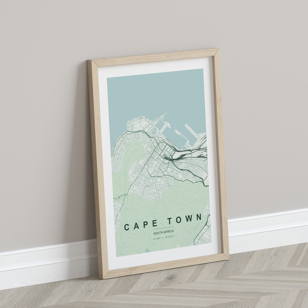 Cape Town, Western Cape, South Africa map print in the Forest theme in a light wooden frame leaning against a pale wall