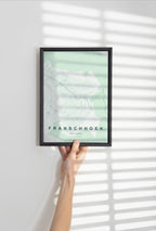 Franschhoek, Western Cape, South Africa map print in the Forest theme in a black frame held against a pale wall