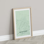 George, Western Cape, South Africa map print in the Forest theme in a light wooden frame leaning against a pale wall