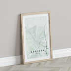 Kariega, Eastern Cape, South Africa map print in the Forest theme in a light wooden frame leaning against a pale wall