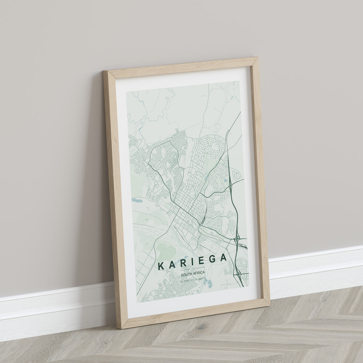 Kariega, Eastern Cape, South Africa map print in the Forest theme in a light wooden frame leaning against a pale wall