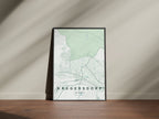 Krugersdorp, Gauteng, South Africa map print in the Forest theme in a black frame on a wooden surface against a pale wall