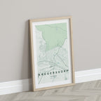 Krugersdorp, Gauteng, South Africa map print in the Forest theme in a light wooden frame leaning against a pale wall