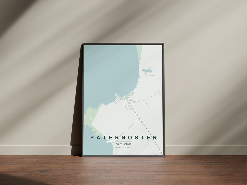 Paternoster, Western Cape, South Africa map print in the Forest theme in a black frame on a wooden surface against a pale wall