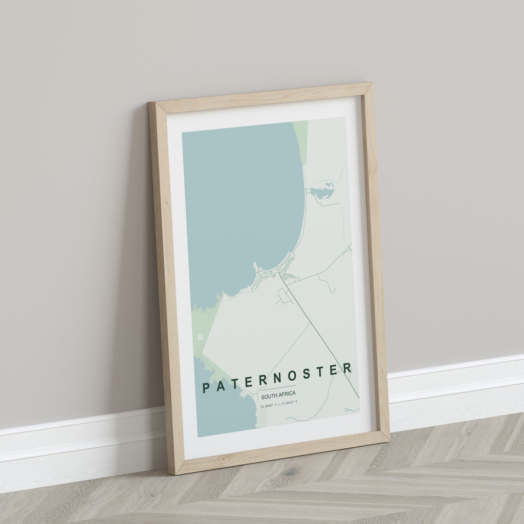 Paternoster, Western Cape, South Africa map print in the Forest theme in a light wooden frame leaning against a pale wall