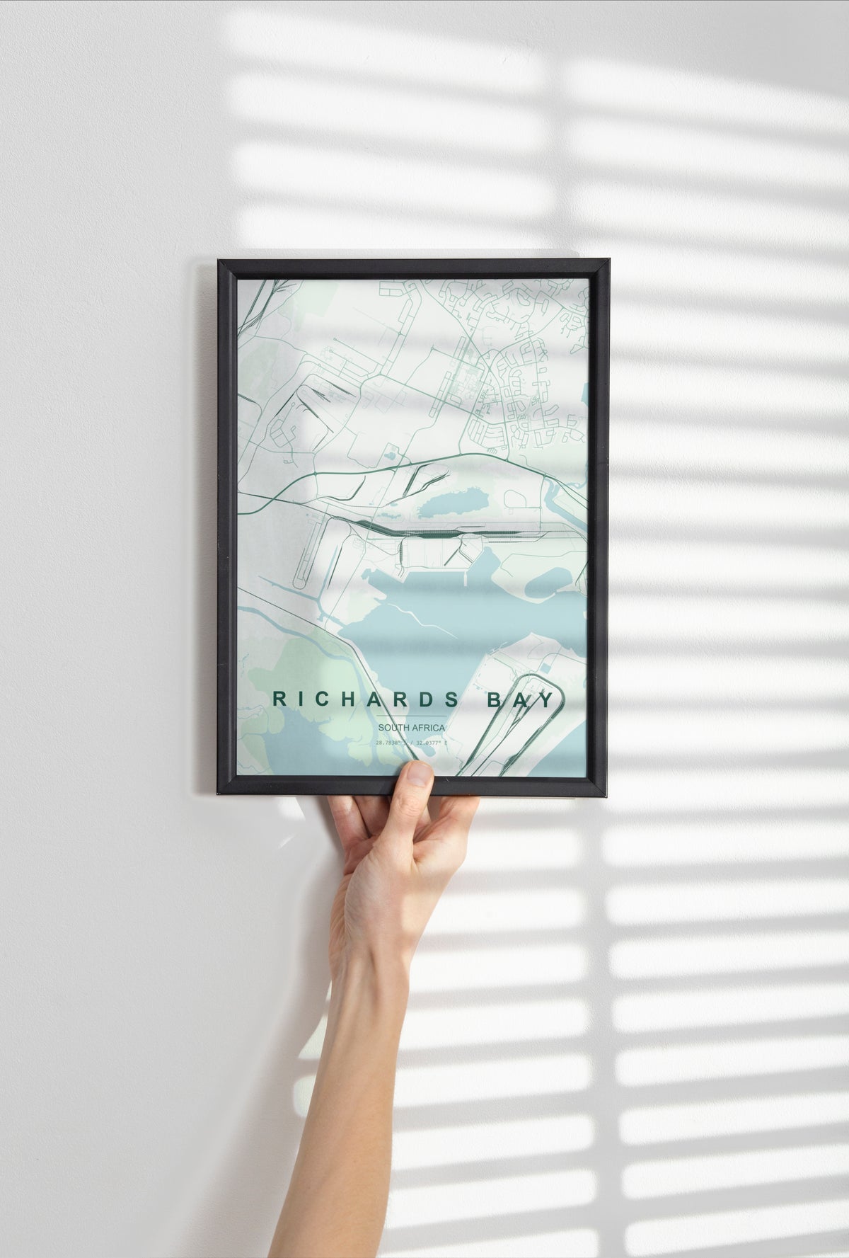 Richards Bay, KwaZulu-Natal, South Africa map print in the Forest theme in a black frame held against a pale wall