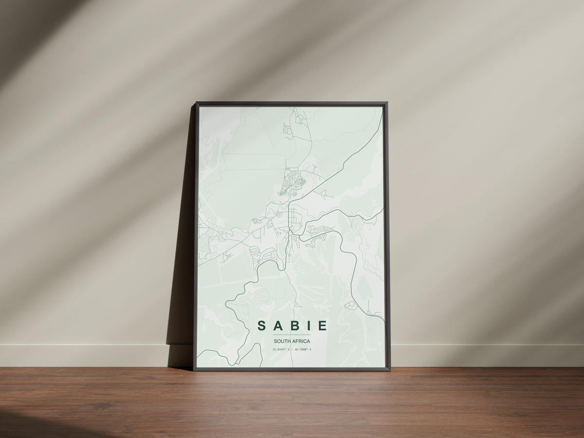 Sabie, Mpumalanga, South Africa map print in the Forest theme in a black frame on a wooden surface against a pale wall