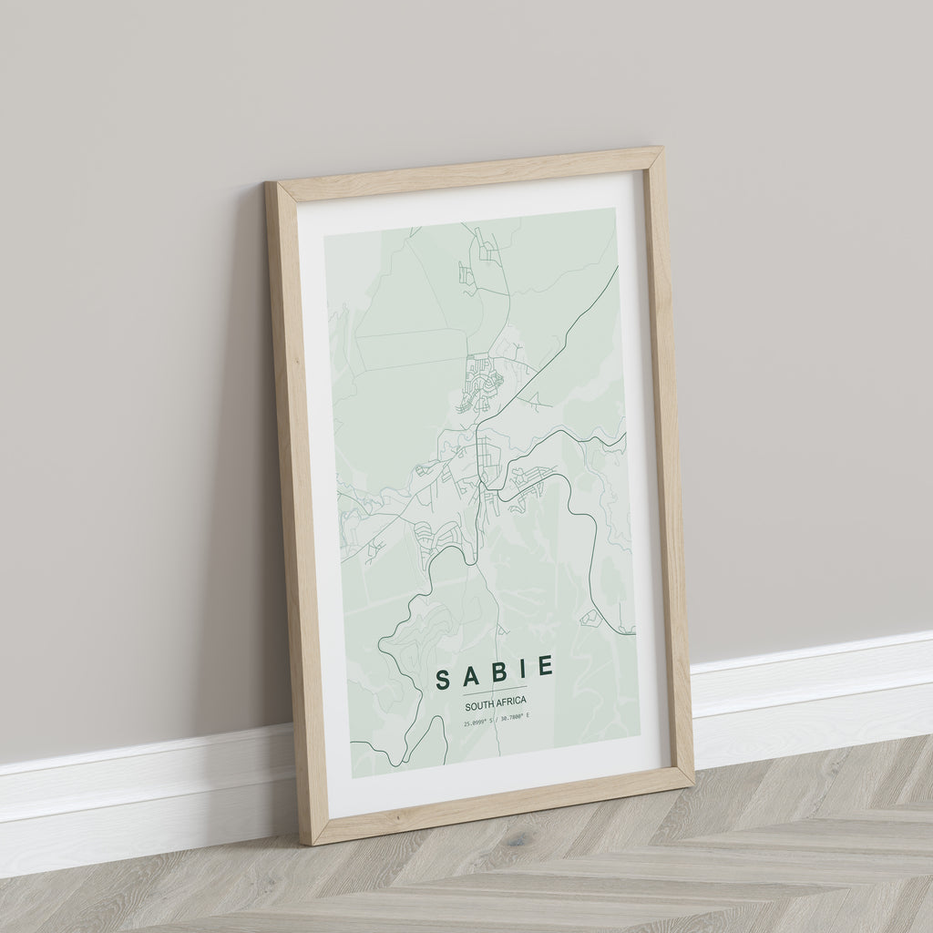 Sabie, Mpumalanga, South Africa map print in the Forest theme in a light wooden frame leaning against a pale wall