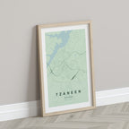 Tzaneen, Limpopo, South Africa map print in the Forest theme in a light wooden frame leaning against a pale wall