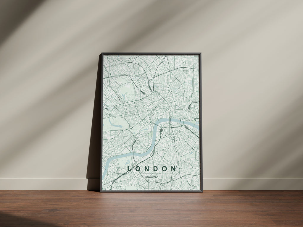London map print in the Forest theme in a black frame beside a pale wall and wooden floor