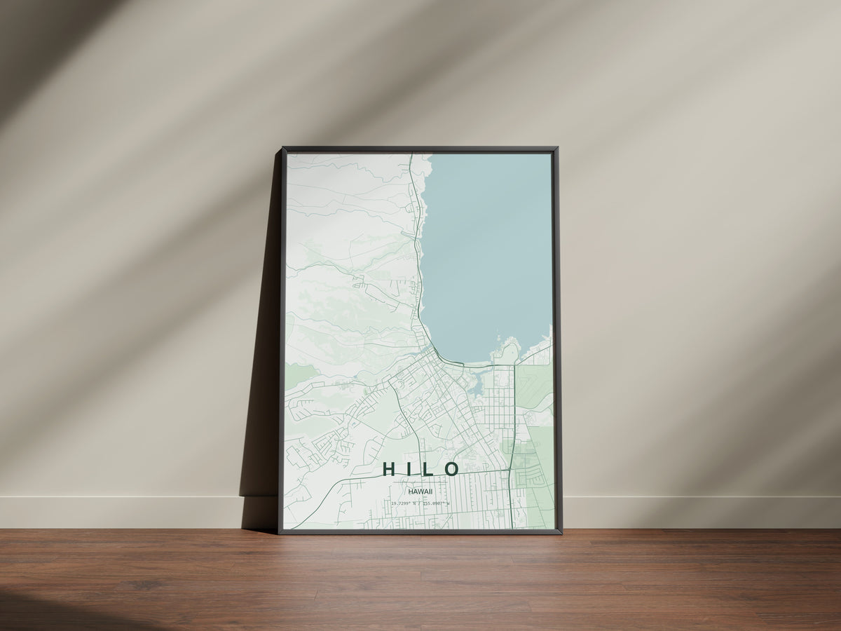 Hilo, Hawaii, United States map print in the Forest theme in a black frame on a wooden surface against a pale wall