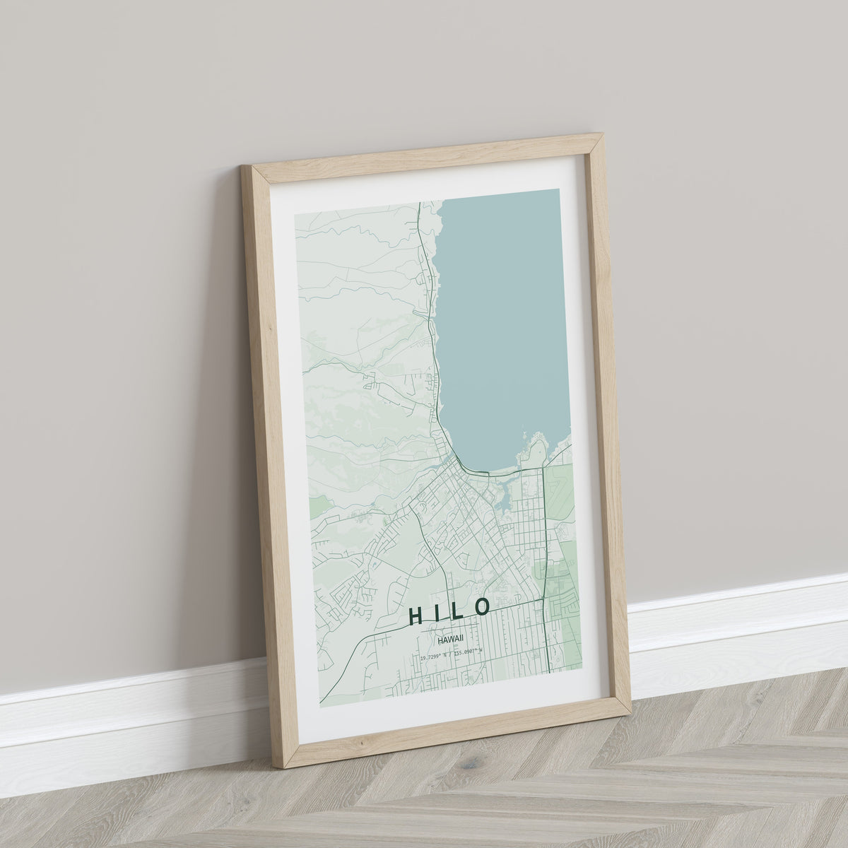 Hilo, Hawaii, United States map print in the Forest theme in a light wooden frame leaning against a pale wall