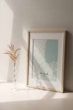 Hilo, Hawaii, United States map print in the Forest theme in a light wooden frame on a shelf beside a glass vase