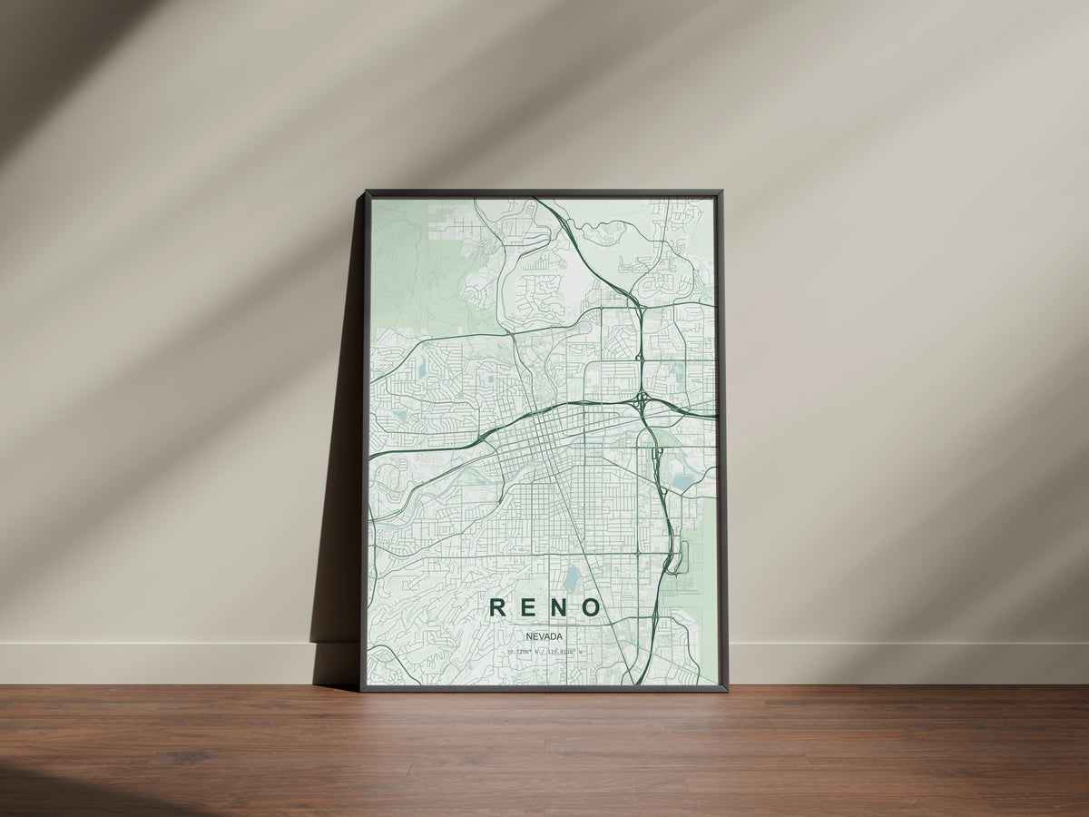 Reno map print in the Forest theme in a black frame on a wooden surface against a pale wall