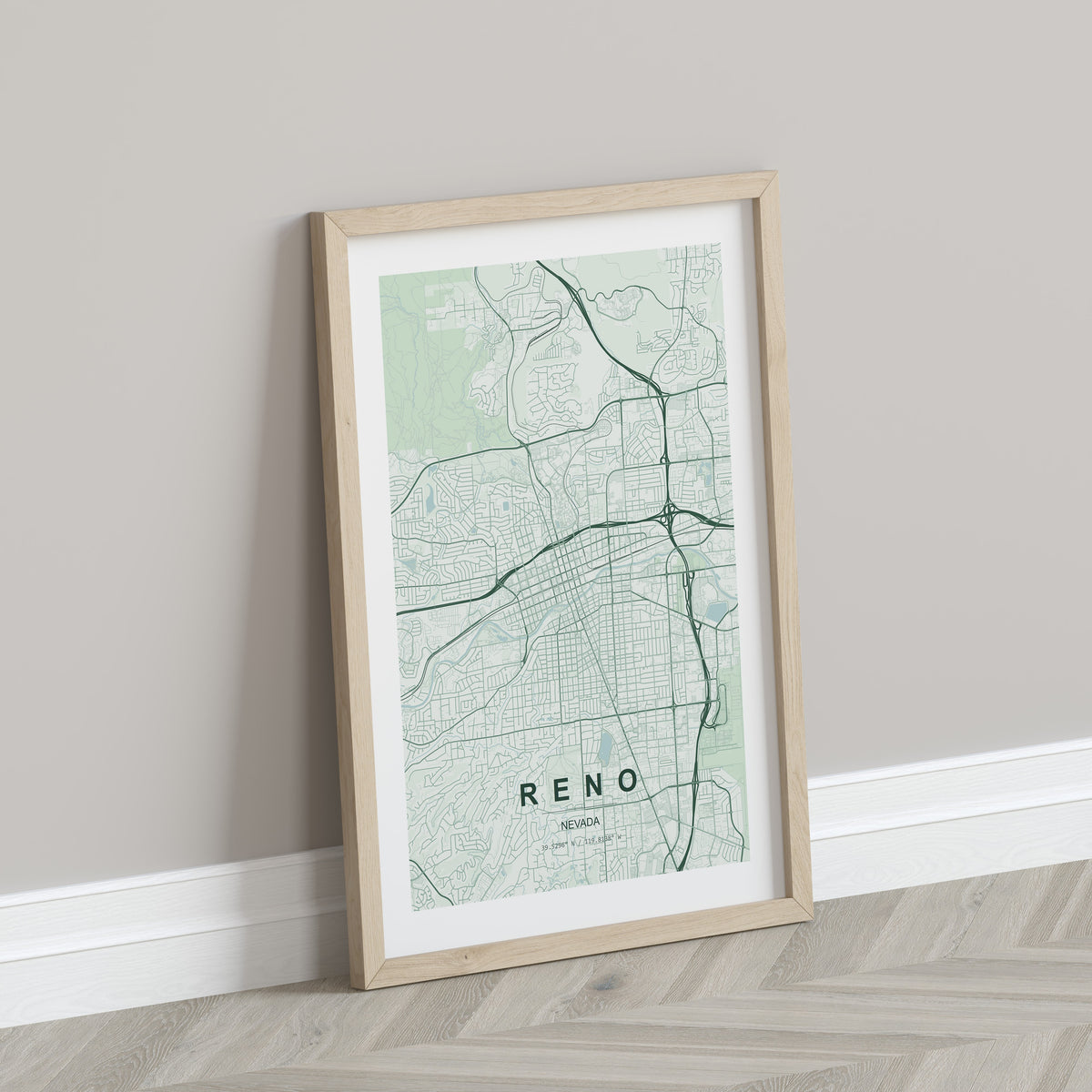 Reno map print in the Forest theme in a light wooden frame leaning against a pale wall