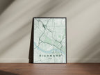 Richmond map print in the Forest theme in a black frame on a wooden surface against a pale wall
